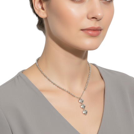 Tempo A Tempo silver stainless steel necklace with three polished heart pendants on a ball chain. Adjustable length.