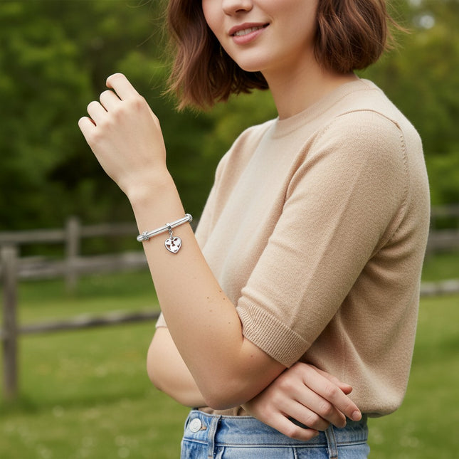 Tempo A Tempo silver-tone steel bracelet with clear resin heart charm and crystal accents.