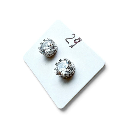 Tempo A Tempo 5mm sterling silver stud earrings with a clear faceted stone in a crown-style setting on a display card