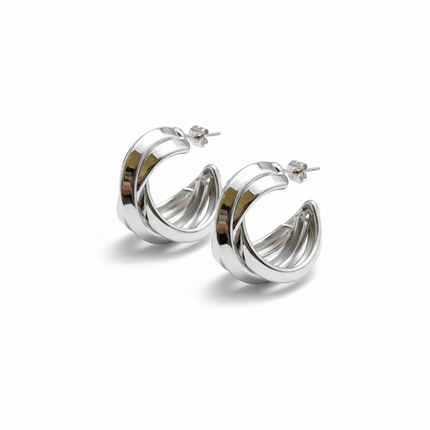 Tempo A Tempo silver stainless steel twisted hoop earrings, 3cm diameter, modern elegant design.