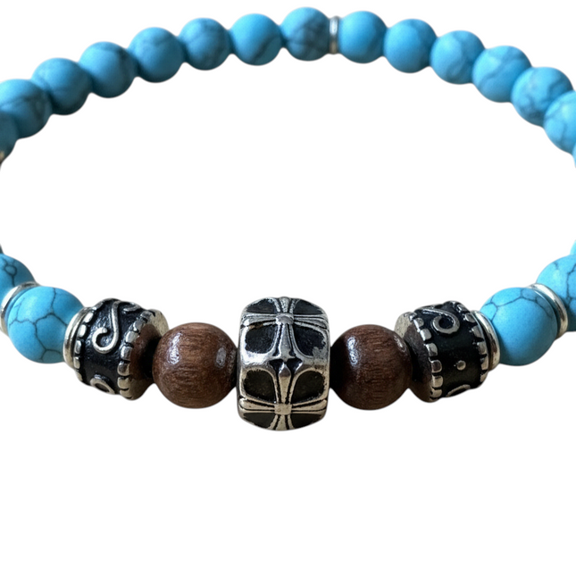 Tempo A Tempo women's elastic bracelet with blue turquoise and brown wood beads, featuring a silver-tone cross charm.