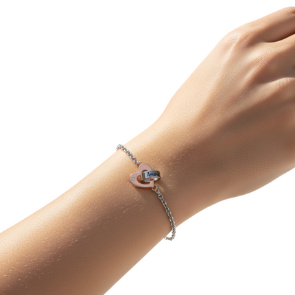 Tempo A Tempo women's two-tone steel bracelet with interlocking hearts, one rose gold with a crystal, the other silver with 'Amore' engraving.