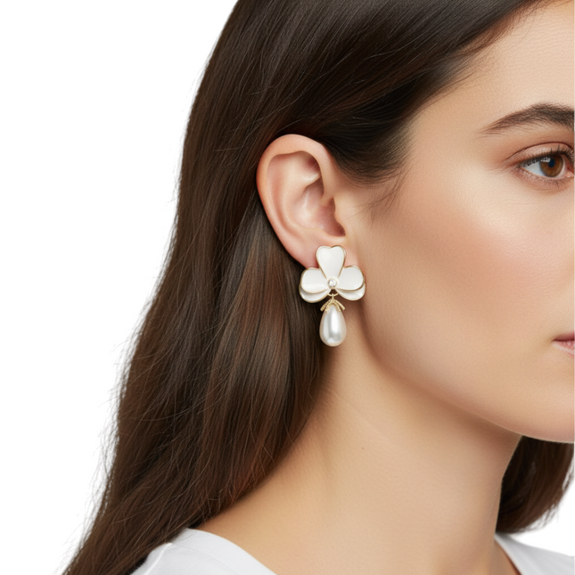 Tempo A Tempo white enamel flower earrings with gold trim and pearl drop. Elegant bridal jewelry.